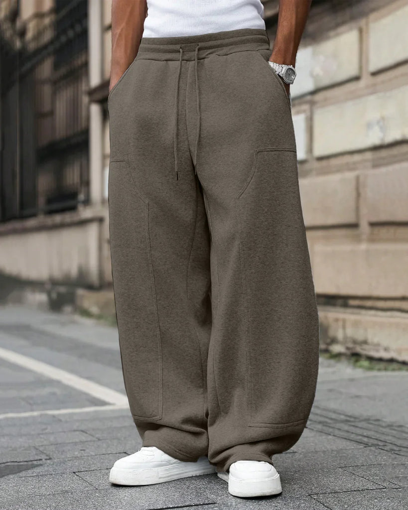 3b2174b90196307fe67a8fedc27bbd95_1024x1024.jpg Men Oversized Drawstring Sweat Pants in Grey - Image 1